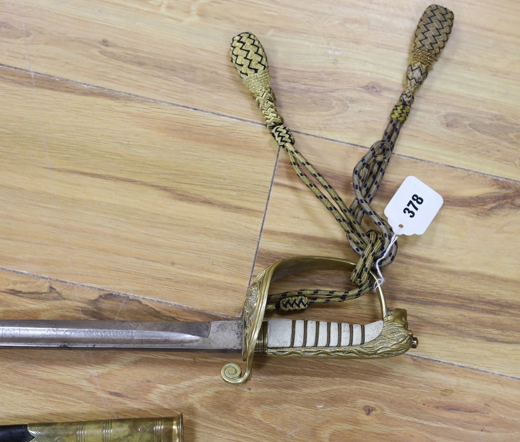 A George V naval officers sword, made by Friedeberg Portsea, serial number 4351 stamped to spine